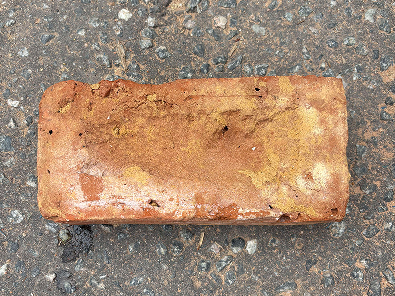 Reclaimed red stock bricks with rich warm hue and weathered texture